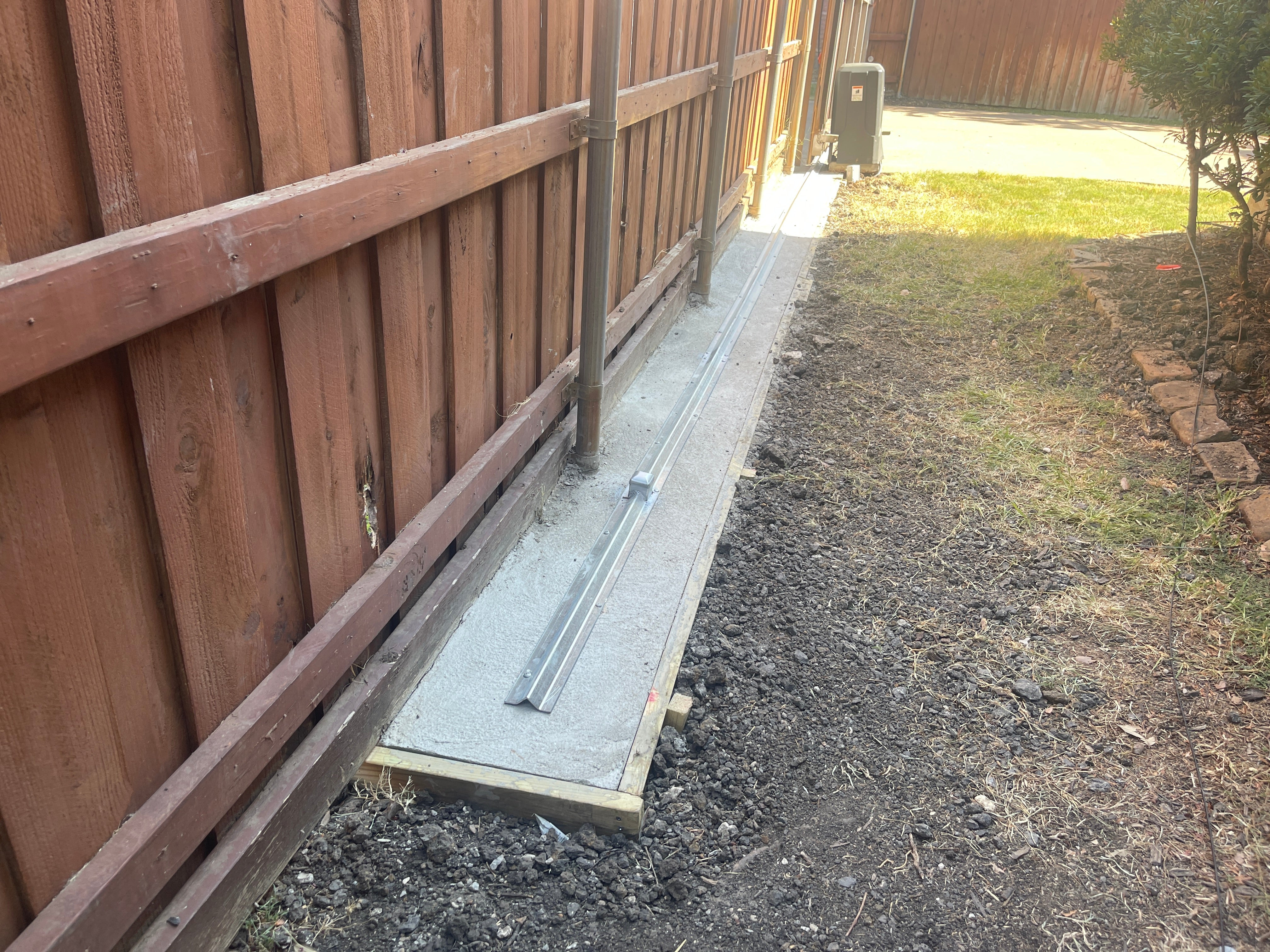 Plano track concrete base installation and fence post repairs – AS GATE ...