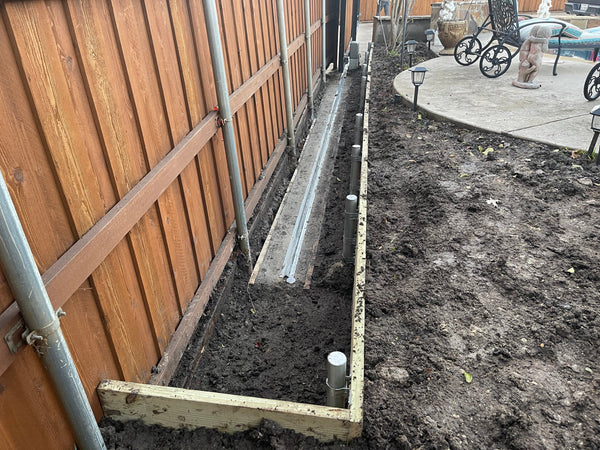 Retaining wall and concrete track base installation in Allen!