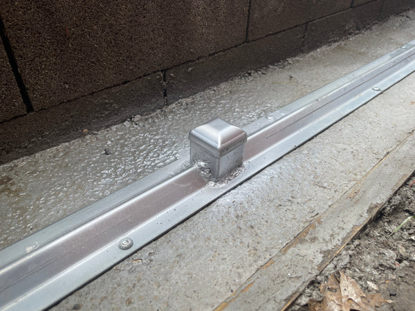 Track concrete base installation in Allen